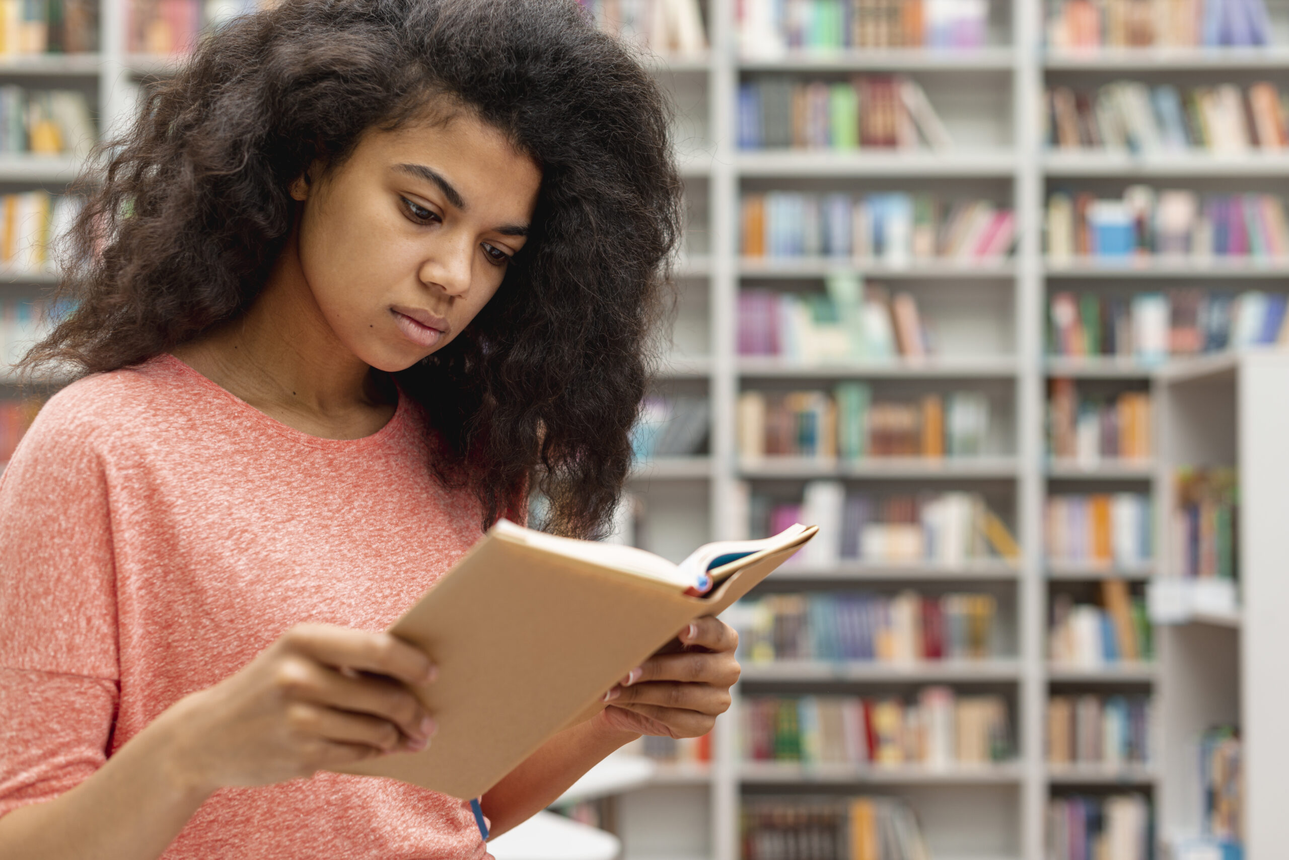side view teenage girl reading